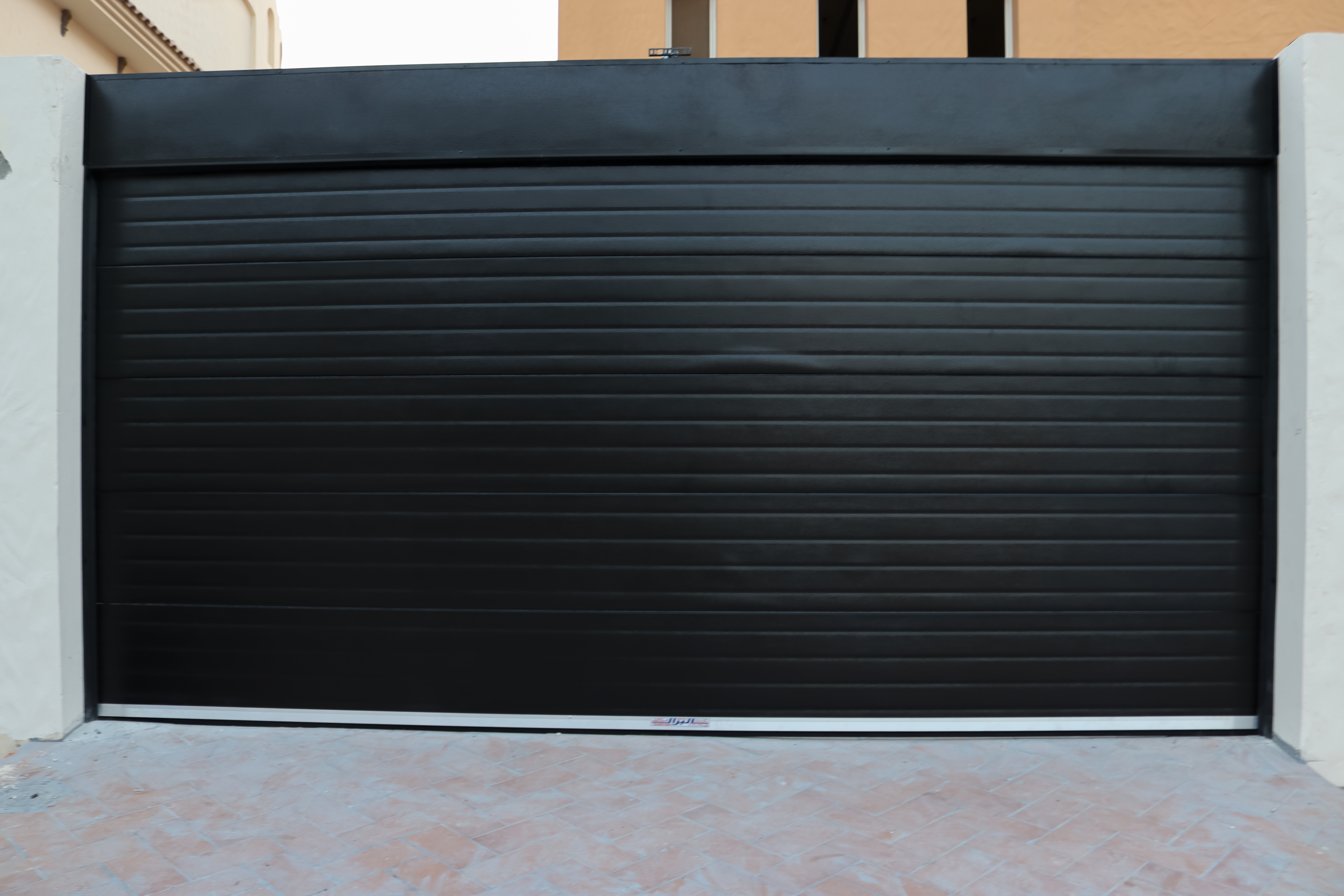 Residential roll-up garage door providing durability, and modern style